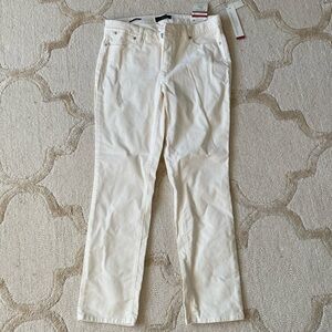 Cream colored corduroy straight leg slimming pants.